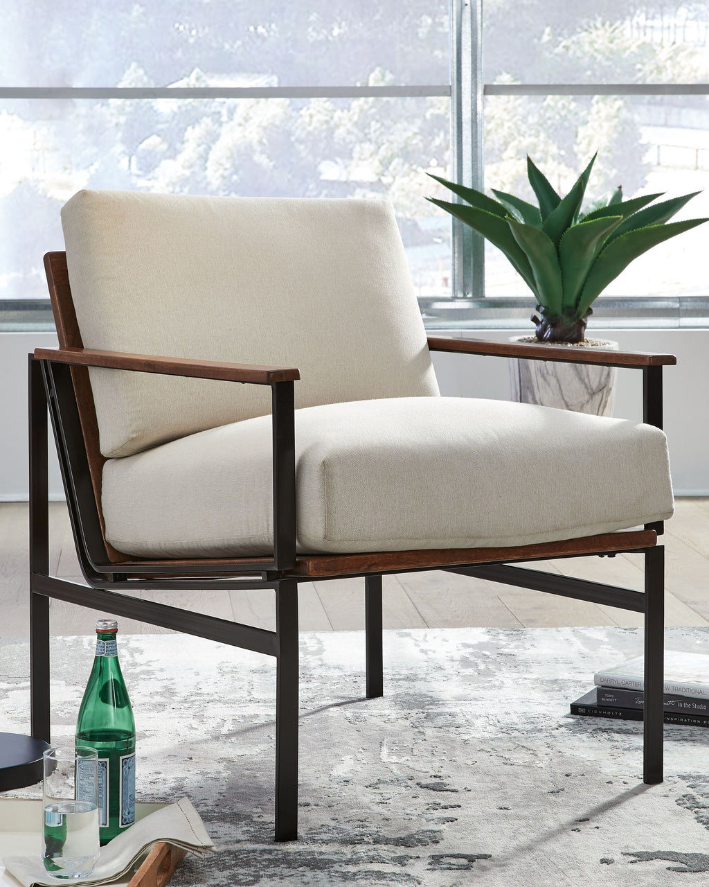 Tilden accent chair with ivory upholstery and brown wood armrests, black metal frame