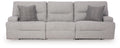 Pewter sectional sofa with three seat sections and two patterned accent pillows