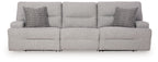 Pewter sectional sofa with three seat sections and two patterned accent pillows