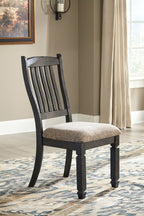 Dark gray dining chair with textured upholstered seat and slatted back