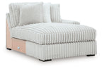 Light gray chaise lounge side view with ribbed base and seat cushions