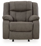 Gunmetal gray rocker recliner with padded backrest, curved armrests, and two legs