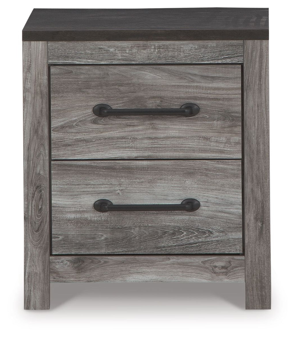 Two-drawer night stand close-up with gray woodgrain drawers and black pull handles.