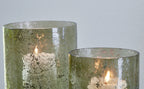 Clarkton green candle holder set (2): lit candles in textured glass cylinders with open rims