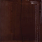 Close-up of brown glass table lamp body with glossy finish