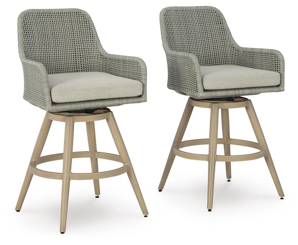 Set of 2 upholstered bar stools with gray fabric, beige cushions, and wood legs