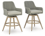 Set of 2 upholstered bar stools with gray fabric, beige cushions, and wood legs