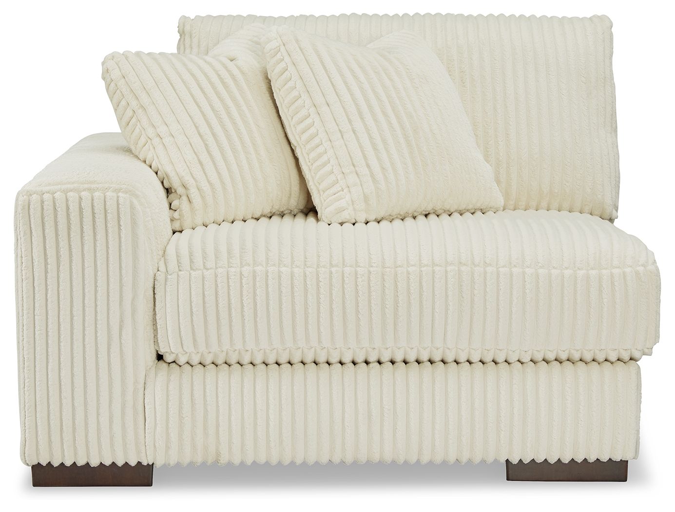 Ivory corner chair with tufted back pillows and padded armrests