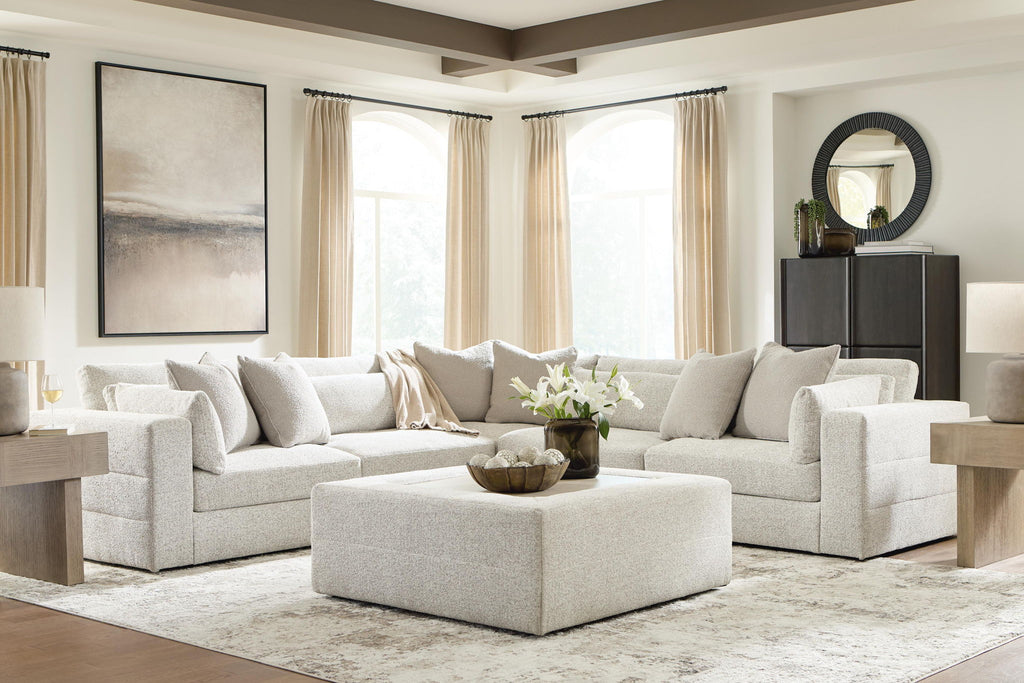 Beige sectional sofa with two chaise ottomans and back pillows