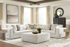 Beige sectional sofa with two chaise ottomans and back pillows