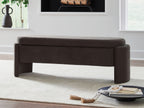 Brown upholstered storage bench with padded top and thick end panels