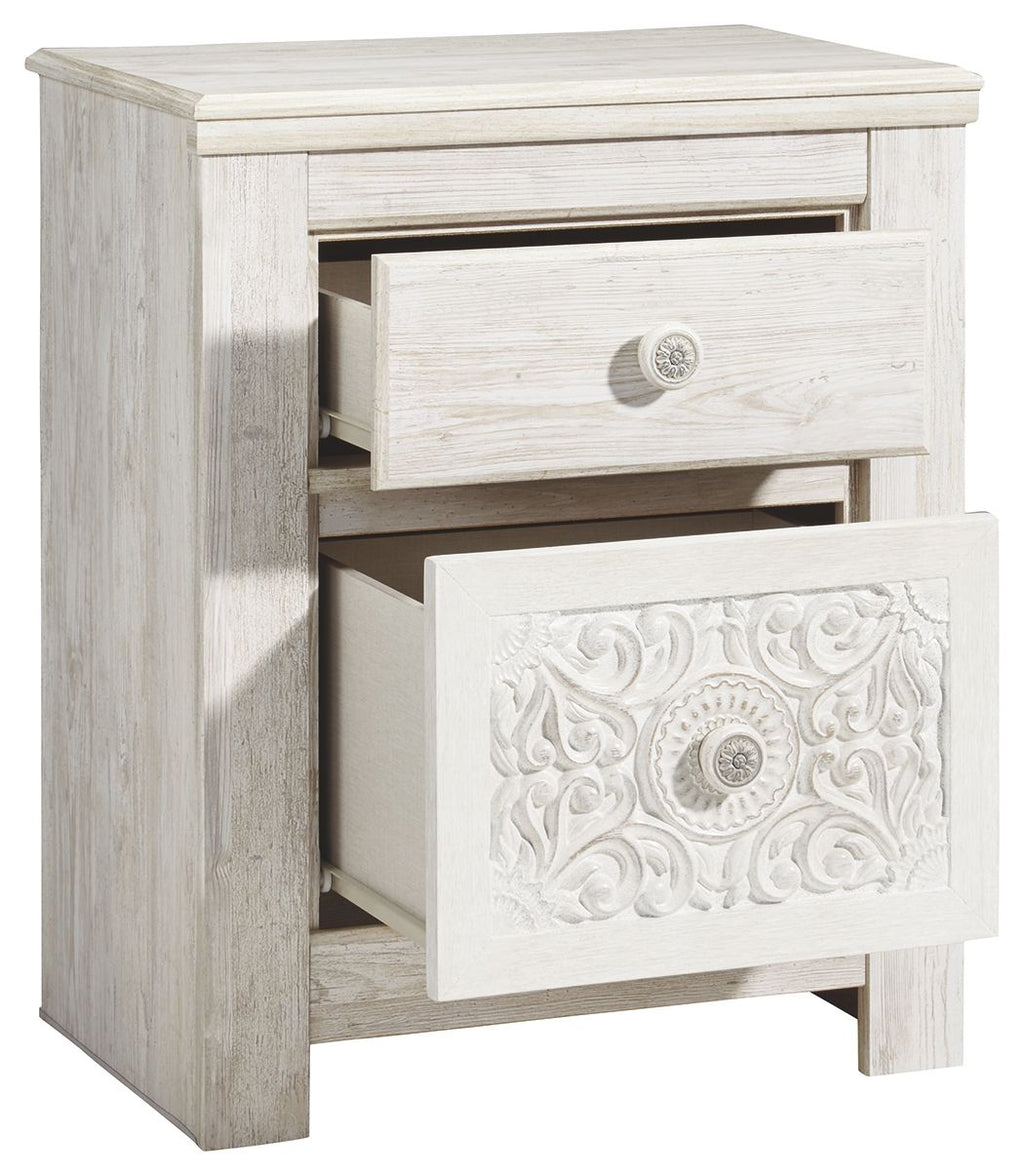 Whitewashed two-drawer night stand with top drawer pulled open to reveal storage