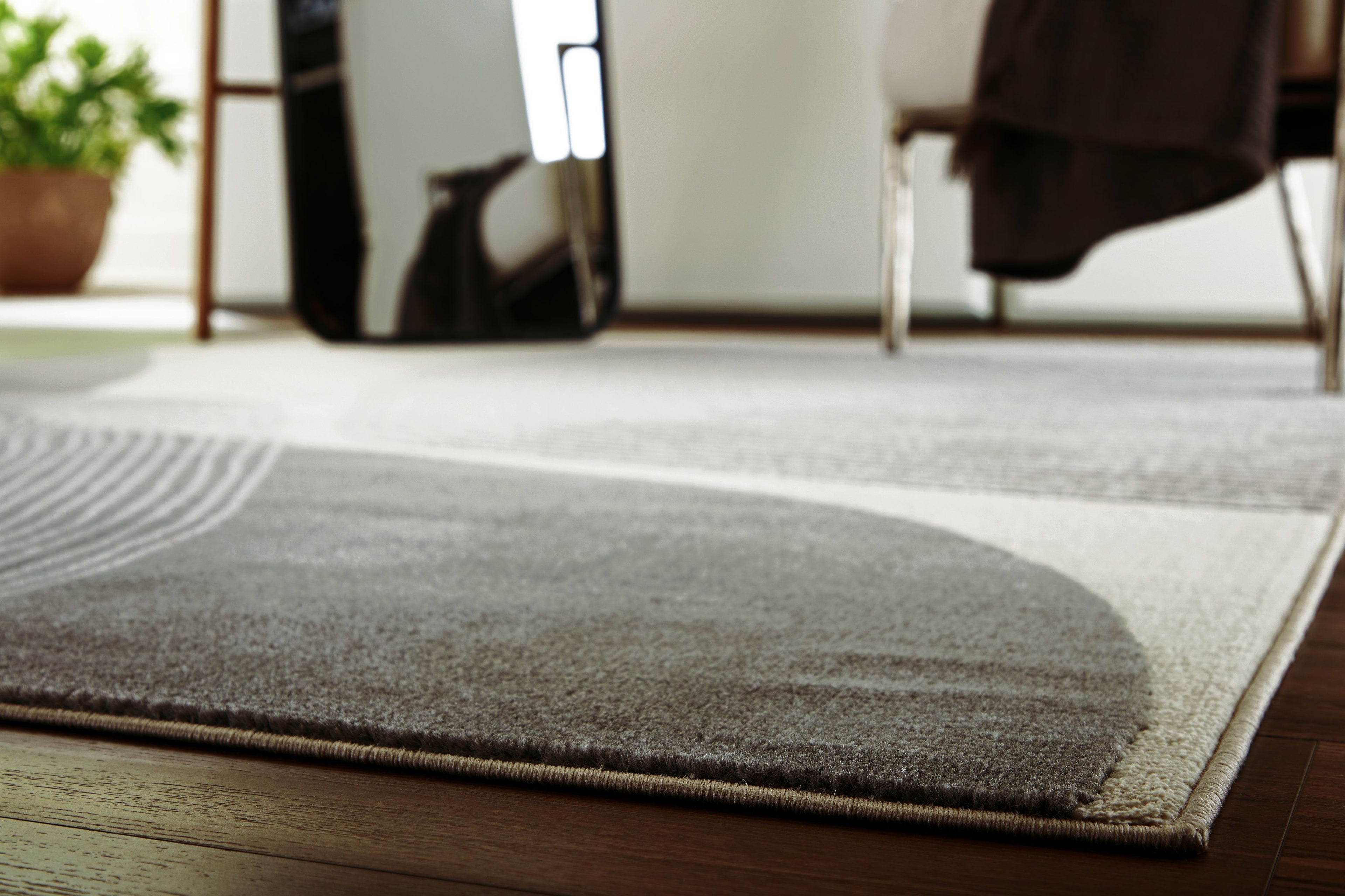 Winderburg rug corner with wavy stripes in dark gray and light gray
