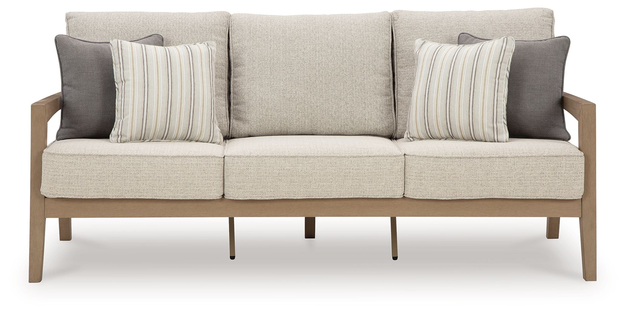 Beige fabric sofa with three back cushions, striped throw pillows, and wooden legs