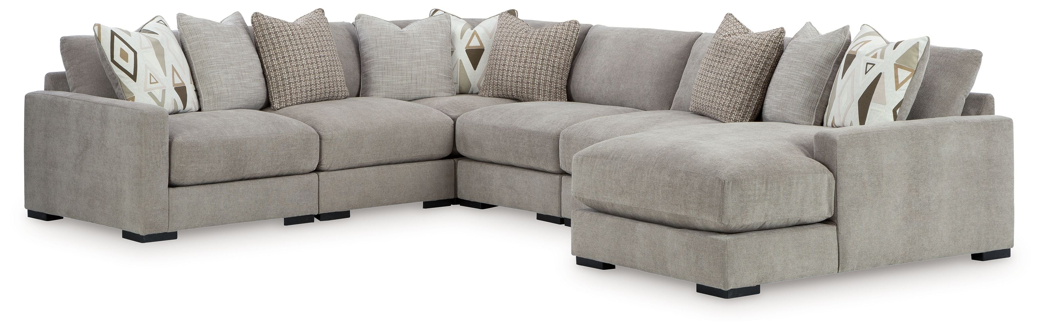 Pebble gray L-shaped sectional sofa with chaise and geometric accent throw pillows