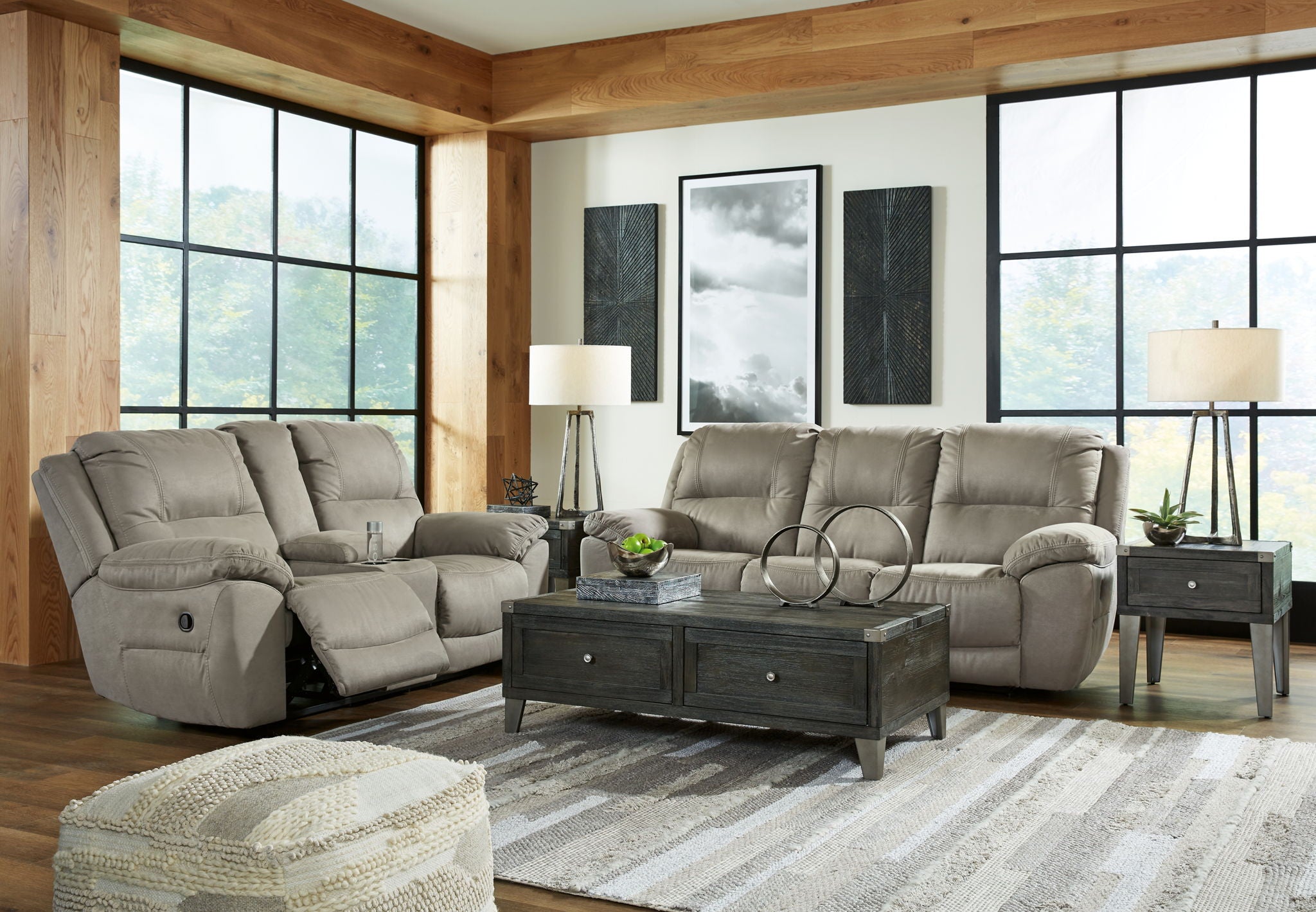 Reclining sofa and loveseat set in light putty gray fabric with wide padded arms