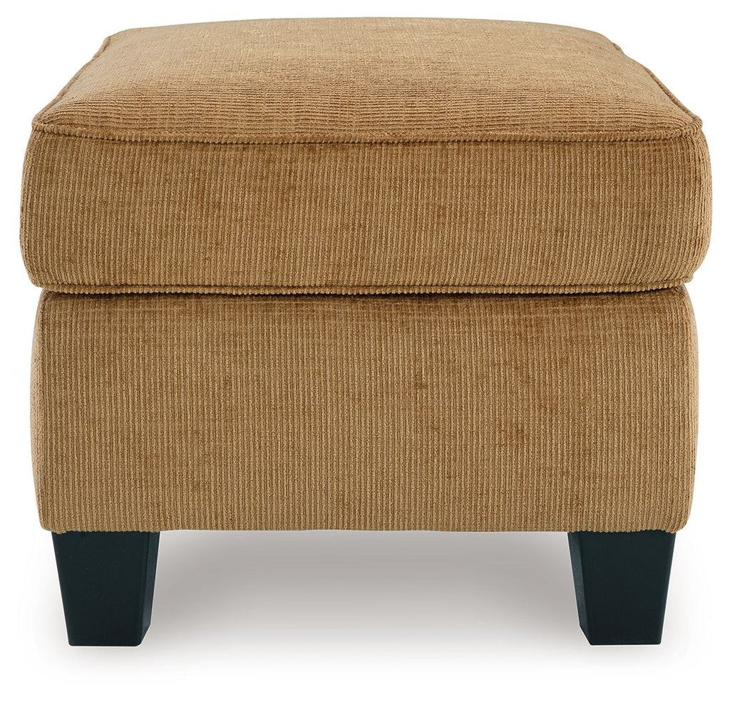 Light brown ottoman with cushioned top and side panels, dark block legs