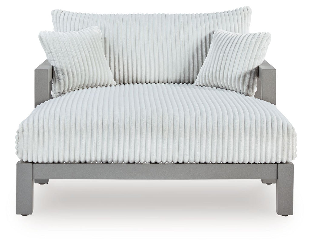 Gray chaise lounge with ribbed seat and back cushion, upholstered in light gray fabric