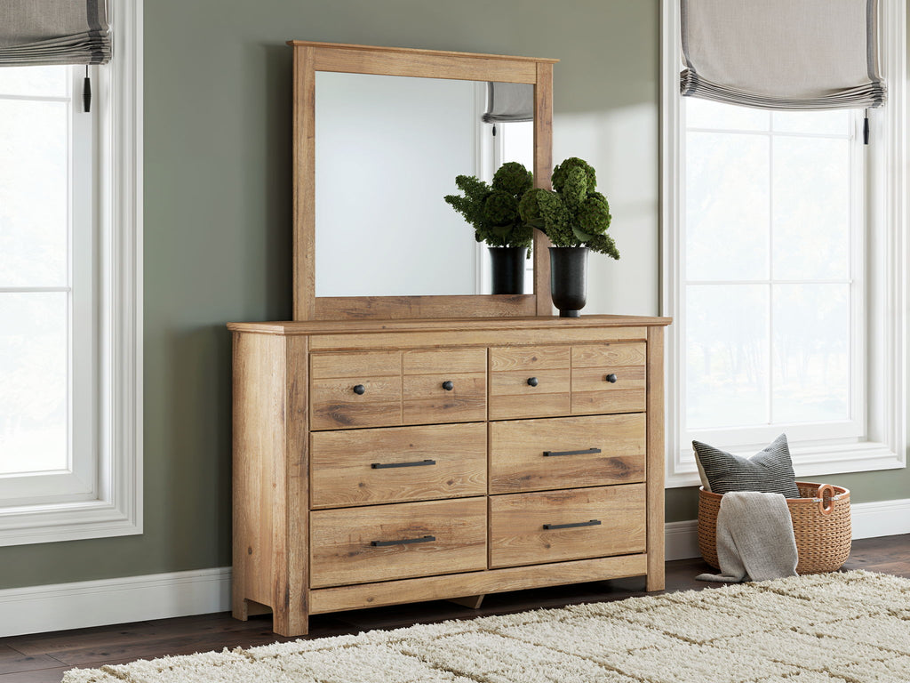 Light brown dresser with mirror and six drawers, black knobs and bar pulls