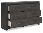 Dark gray six-drawer dresser with two drawers open, showing light interior