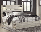Bedroom set bed with light wood frame and plaid bedding, plus matching headboard panel