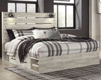 Light beige panel bed with side drawers and slatted headboard, black-and-white plaid bedding