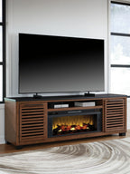 Dark brown TV stand with fireplace insert beneath a wall-mounted TV