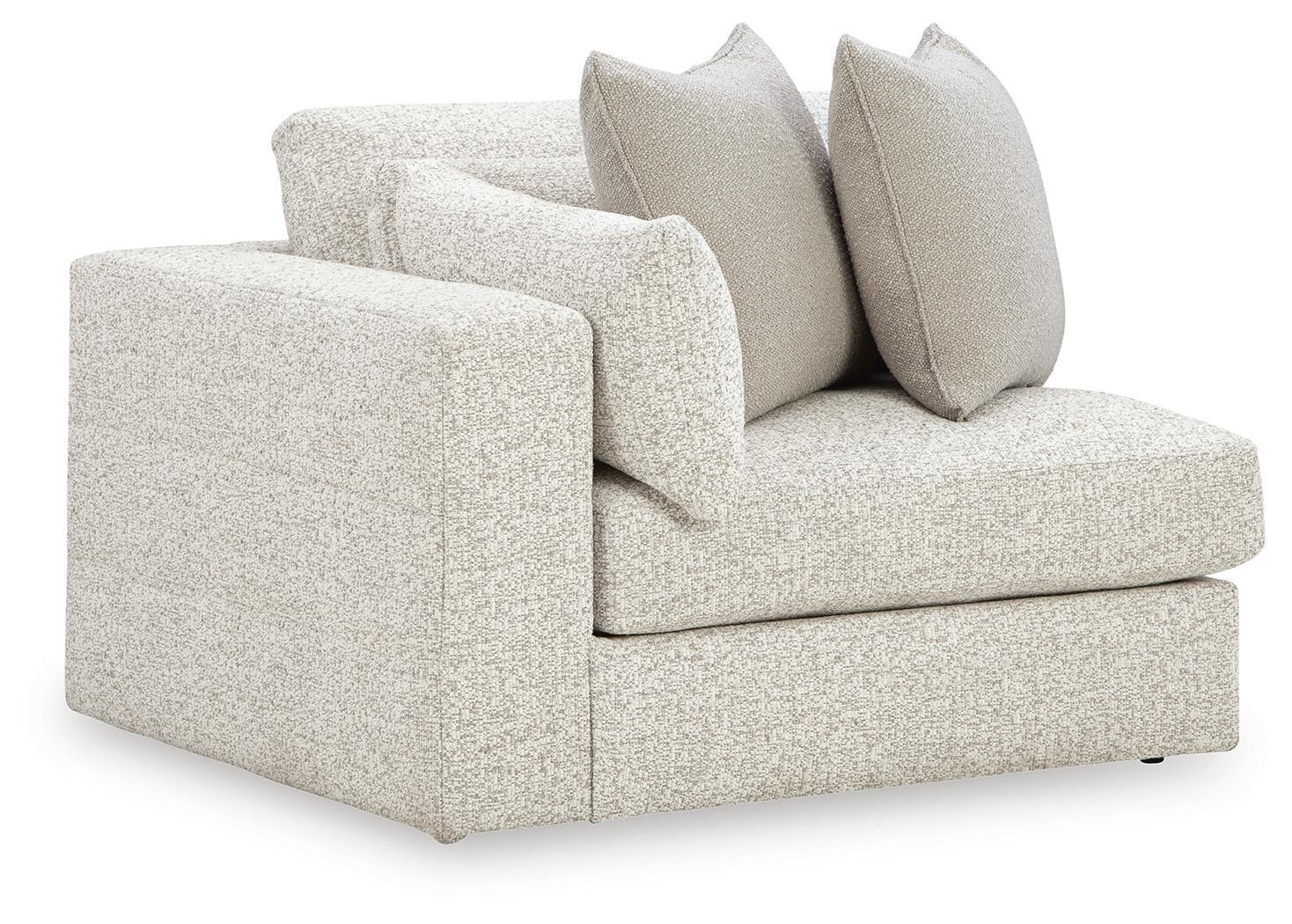Snowstone corner chair with light textured fabric, square arms, and three back cushions