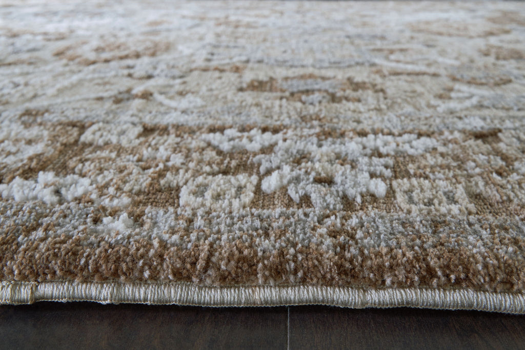 Memory foam rug close-up of plush pile with light cream and dark brown flecked pattern