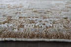 Memory foam rug close-up of plush pile with light cream and dark brown flecked pattern