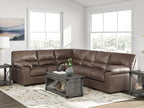 Brown sectional sofa with tufted back, deep seats, and chaise corner