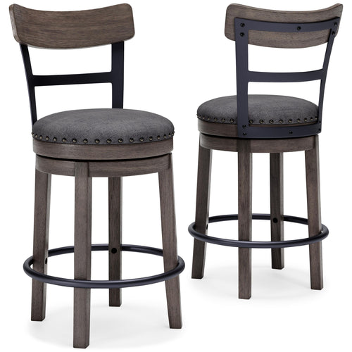 Gray upholstered swivel bar stool with round seat, nailhead trim, and curved footrest