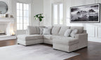 Gray sectional sofa with chaise, three seat back cushions, rounded arms, dark legs