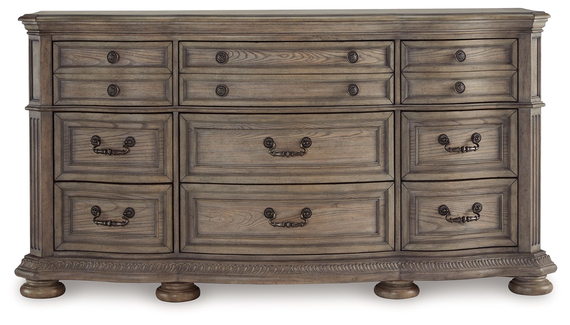 Light brown wood dresser front with rows of drawers and black handle pulls