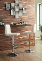 Two beige adjustable barstools with padded seats, tall backs, chrome bases and footrests