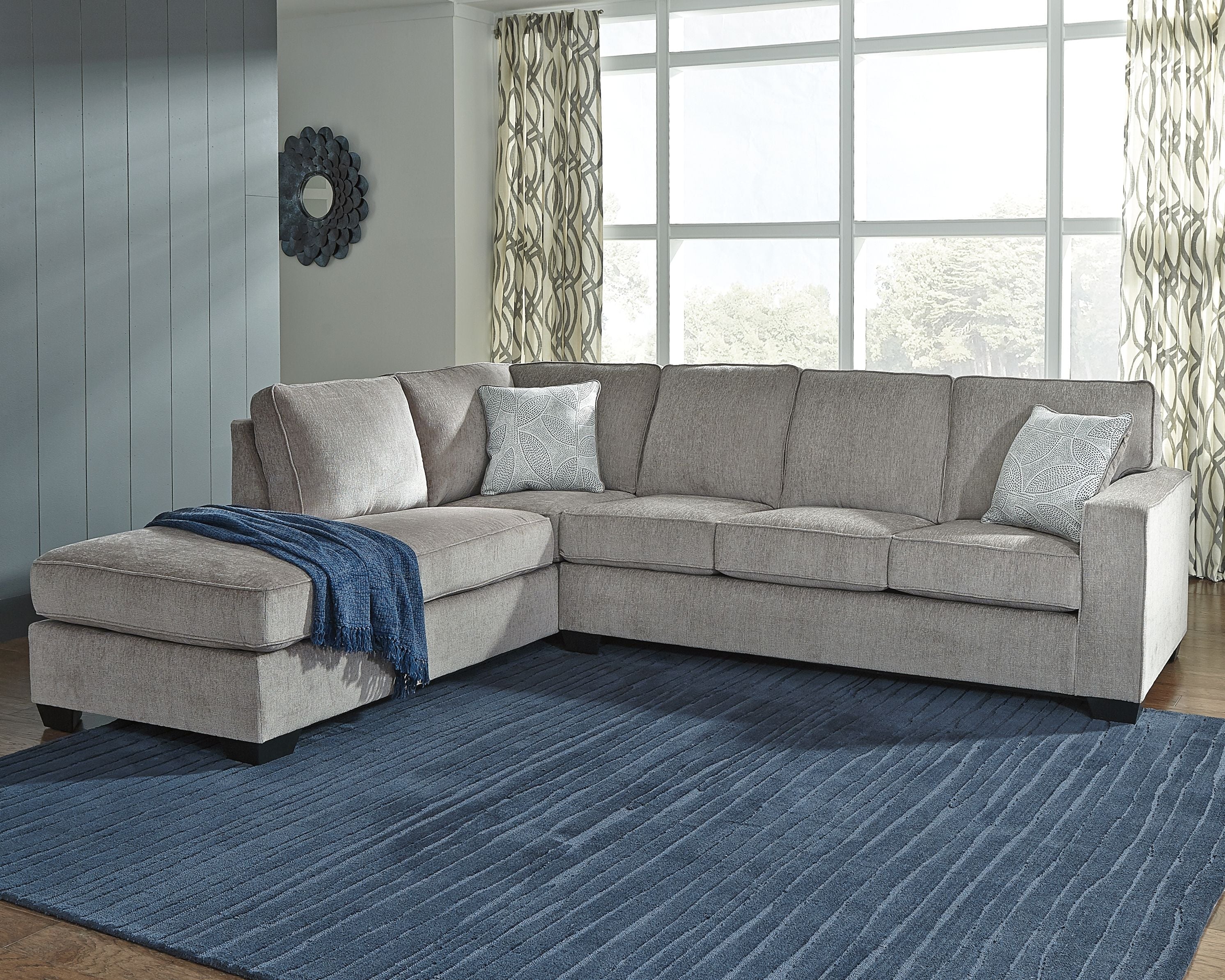 Alloy sleeper sectional sofa with left chaise, square arms, and two decorative throw pillows