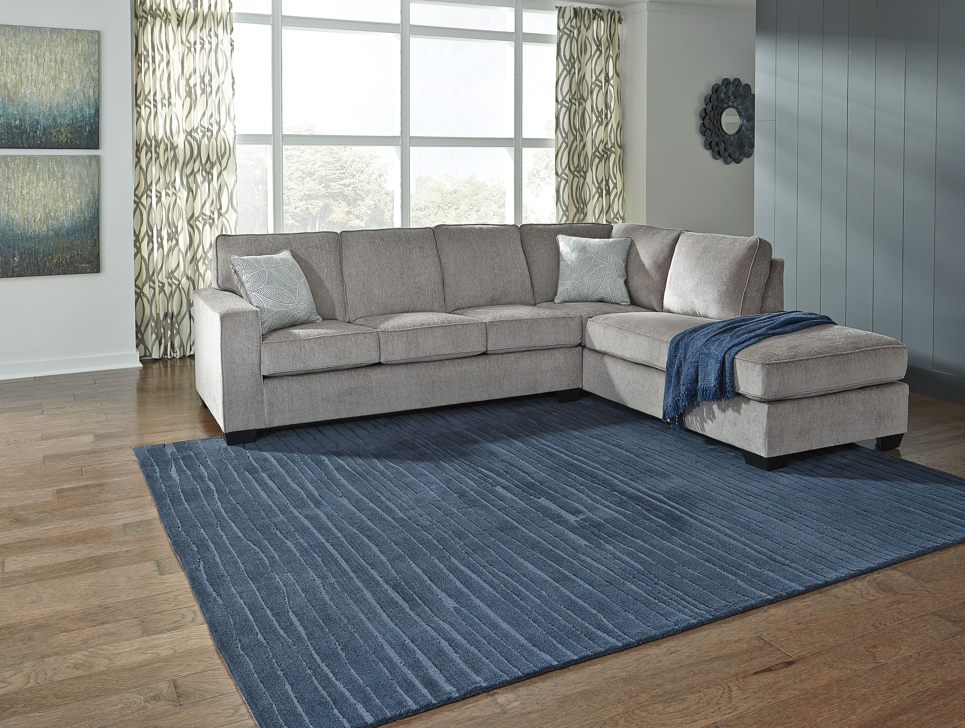 Alloy sleeper sectional sofa with left chaise, square arms, and two decorative throw pillows