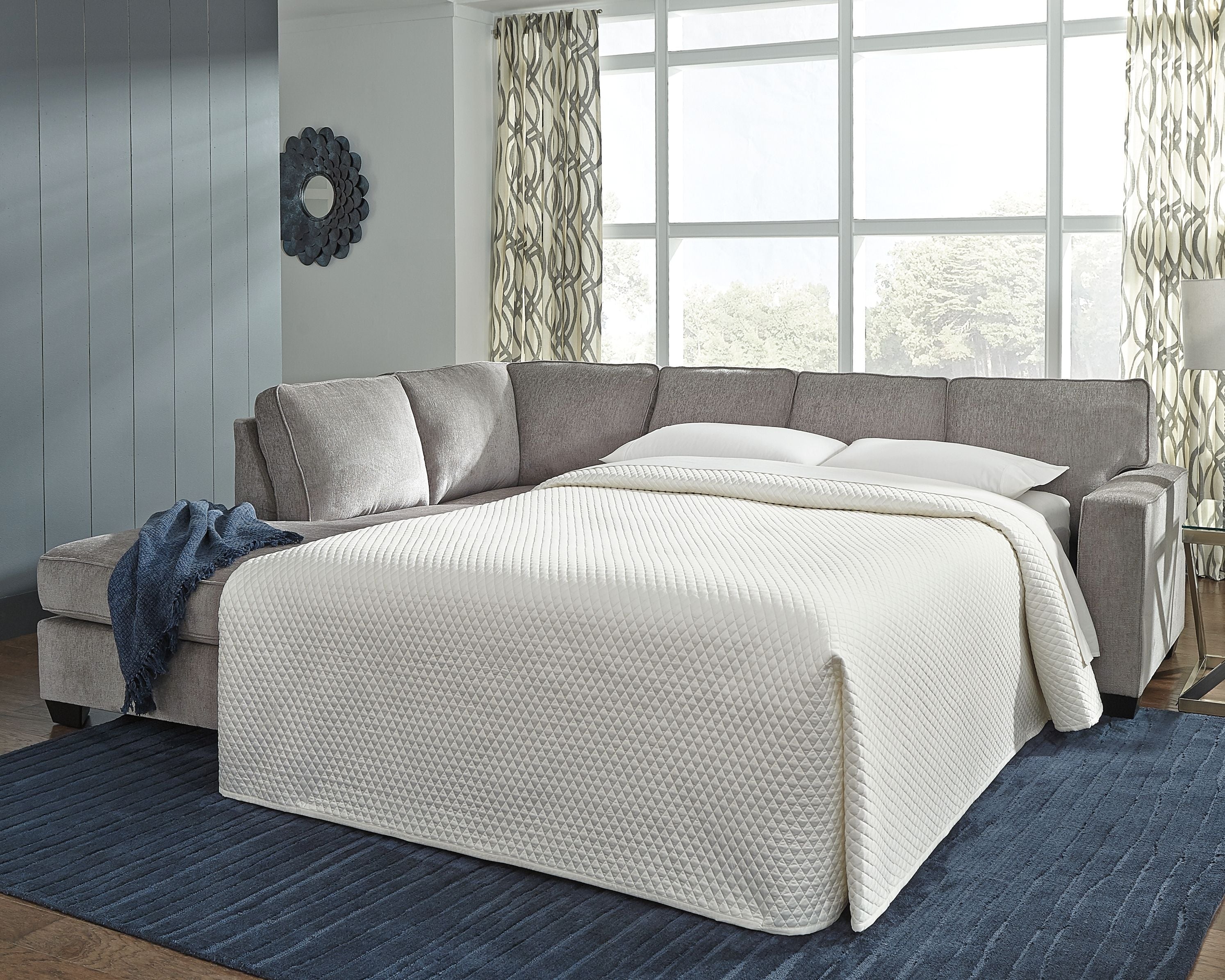 Alloy sleeper sectional sofa with chaise and extended sleeper bed, with throw pillows