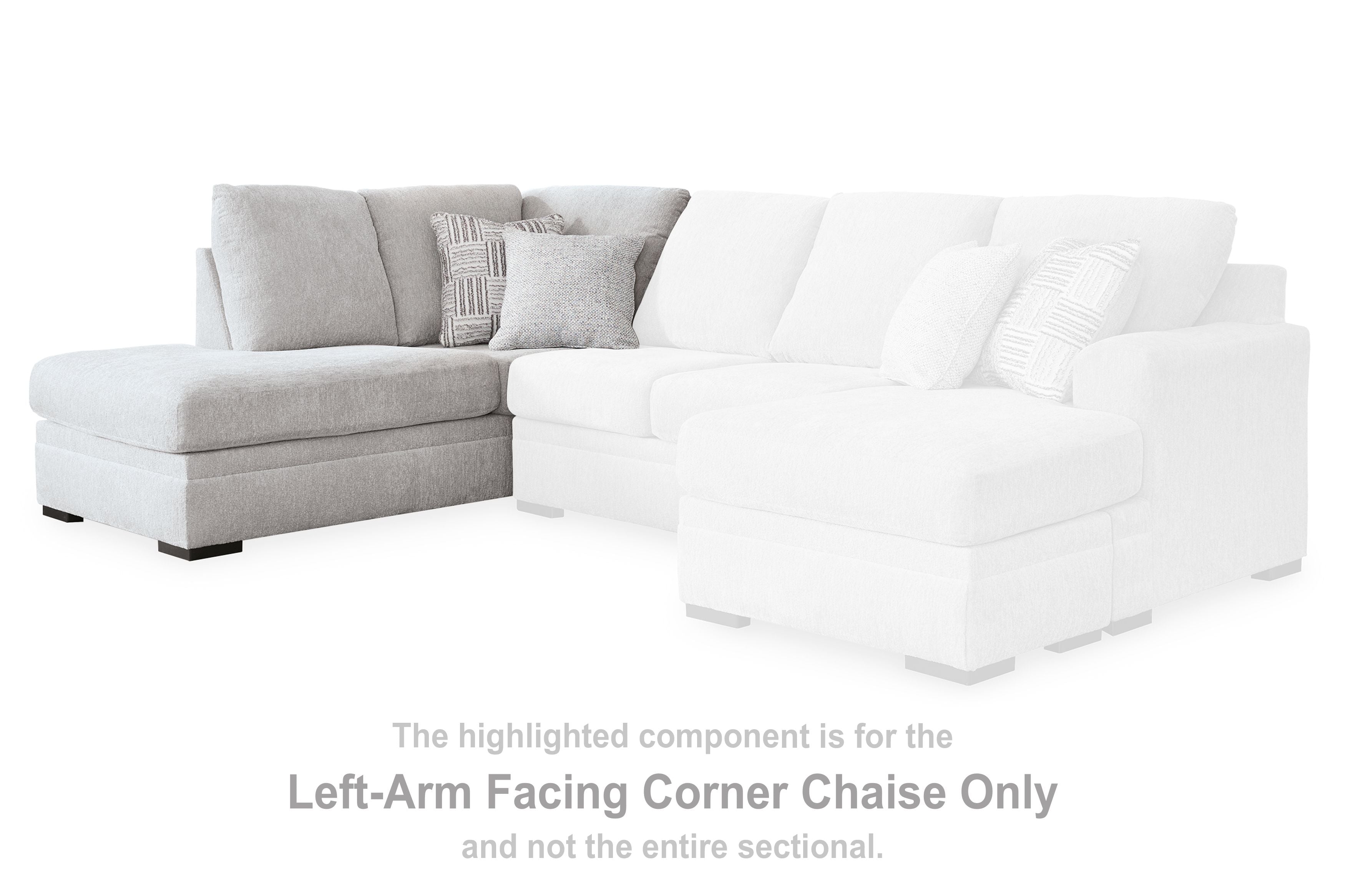 Corner chaise sofa with white chaise section, light gray cushions, and patterned pillows