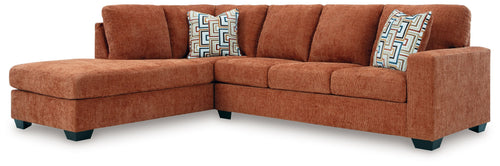 Spice rust sectional sofa with corner chaise and three geometric accent cushions