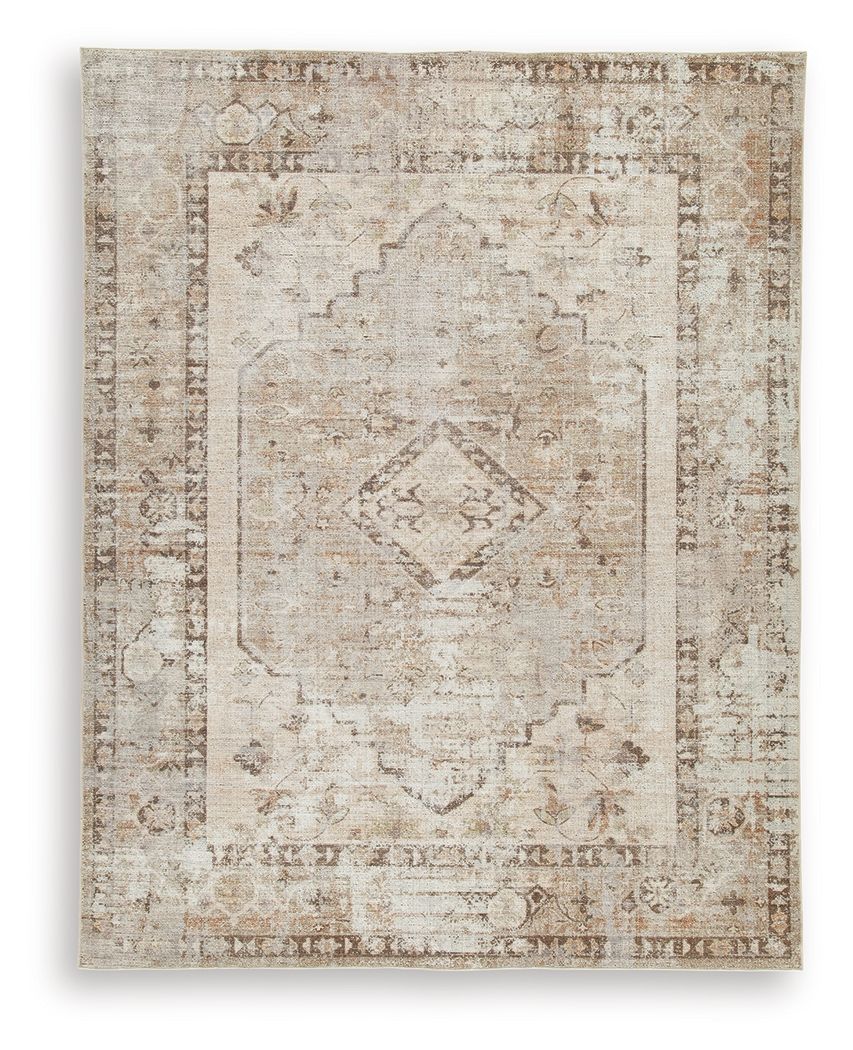 Washable rug with light brown distressed geometric medallion and border