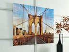 Framed wall art print of bridge walkway stretching forward between towers