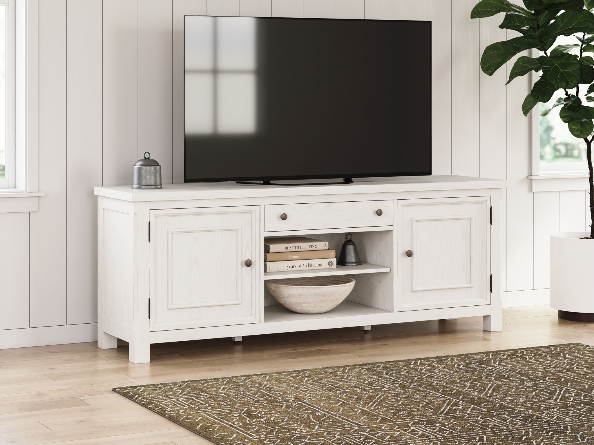 Antique white TV stand with top drawers, open center media shelf, and side cabinet doors