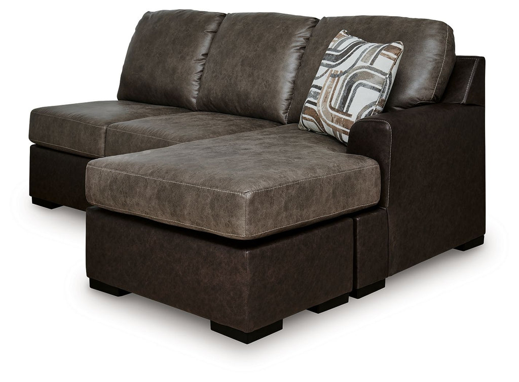 Sofa chaise with wide chaise ottoman in dark brown fabric, back cushions and throw pillow
