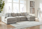 Light gray sectional sofa with chaise and patterned accent pillows