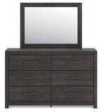 Dark gray dresser with six drawers and square wall mirror