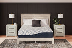 California king mattress with white cover and blue oval grid on dark blue base