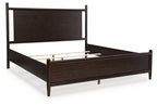 Dantenton panel bed in dark brown with open base and white mattress platform