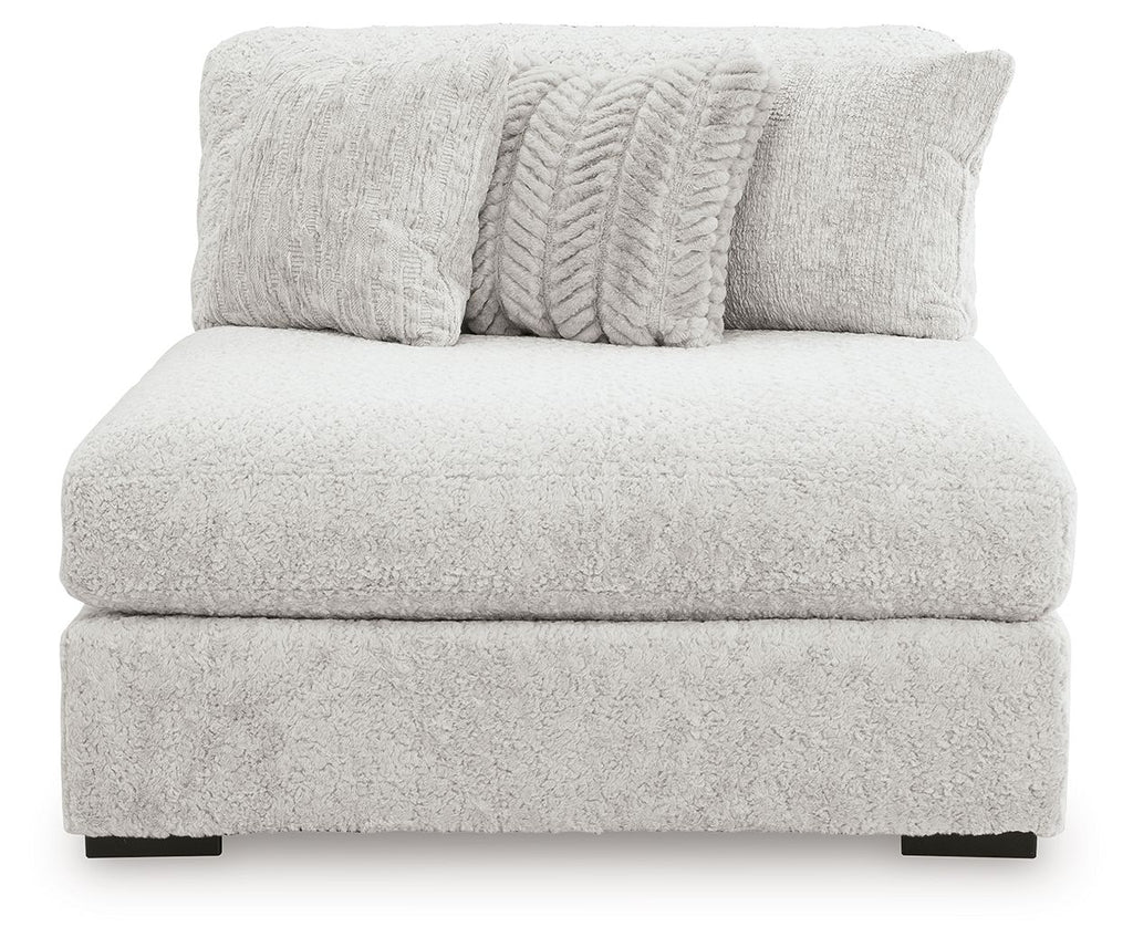 Armless chaise in light gray textured fabric with two decorative pillows and thick seat