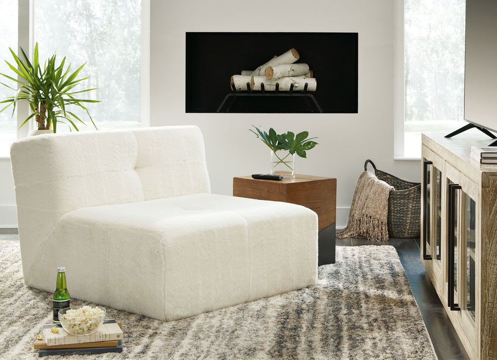 Ivory accent chair with textured upholstery, rounded back, and thick seat cushion